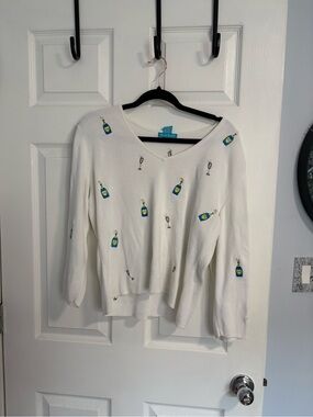 Alexandra Bartlett White V-Neck Sweater with Blue & Yellow Champagne Motif
